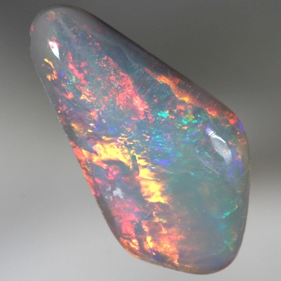SOLID SEMI BLACK OPAL Bright reds roll over green and blue. SEE VIDEO
